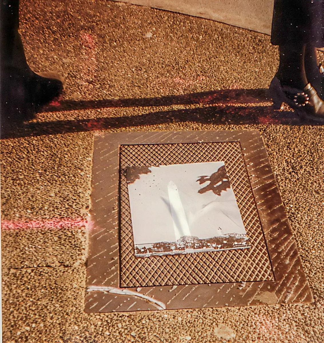 Monuments, photocopied poster on sidewalk vault cover, public right-of-way, Pioneer Square, Seattle, 1993.