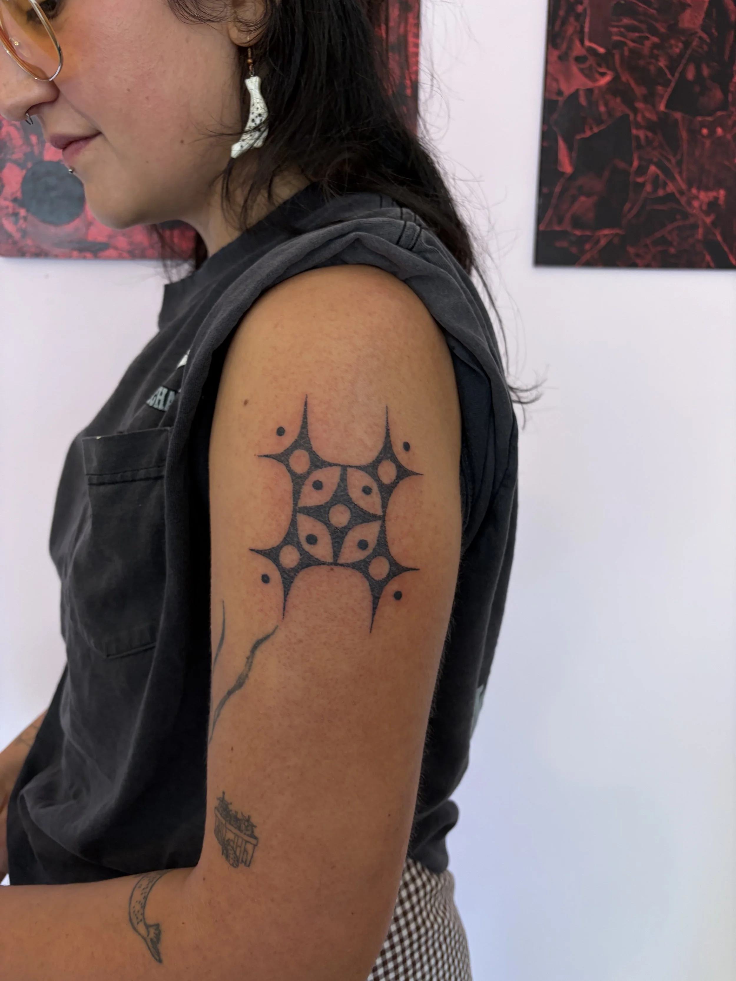 Handpoked four point star design made by Ari aka @quwutsunmade. 