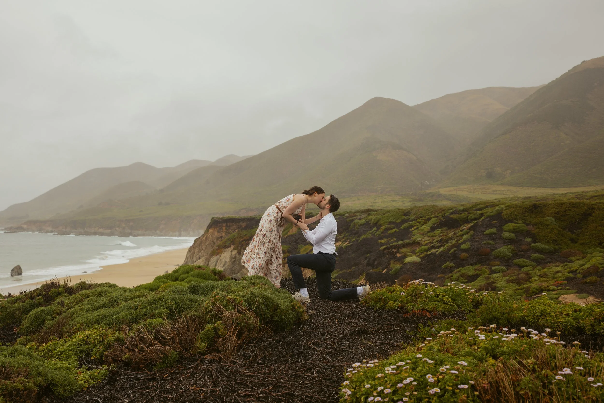 girl kissing guy after Carmel Proposal at garrapata state park
