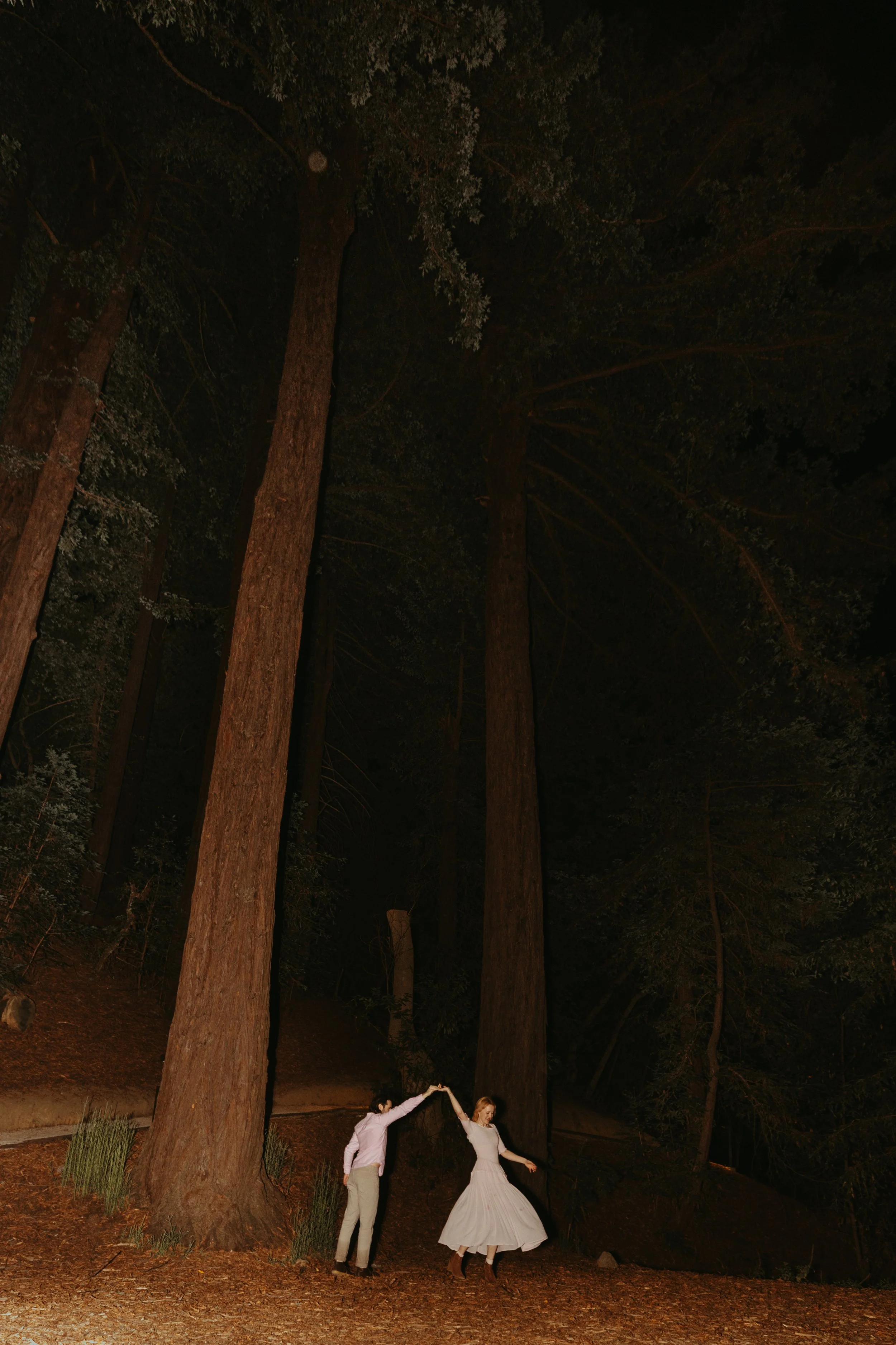 couple dancing in the redwoods at Ventana in Big Sur after their proposal
