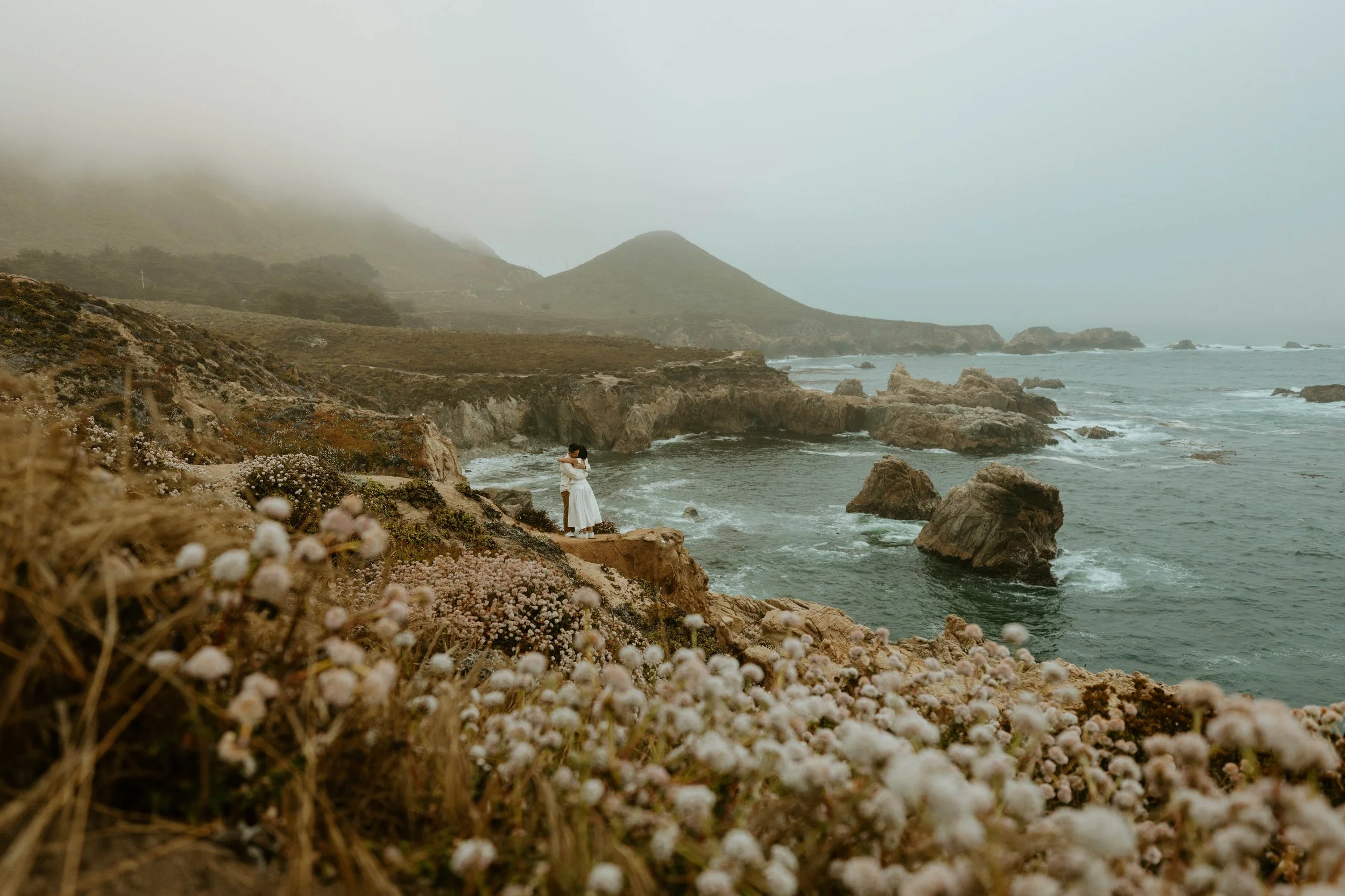 couple embracing after saying getting married in Big Sur with no permit