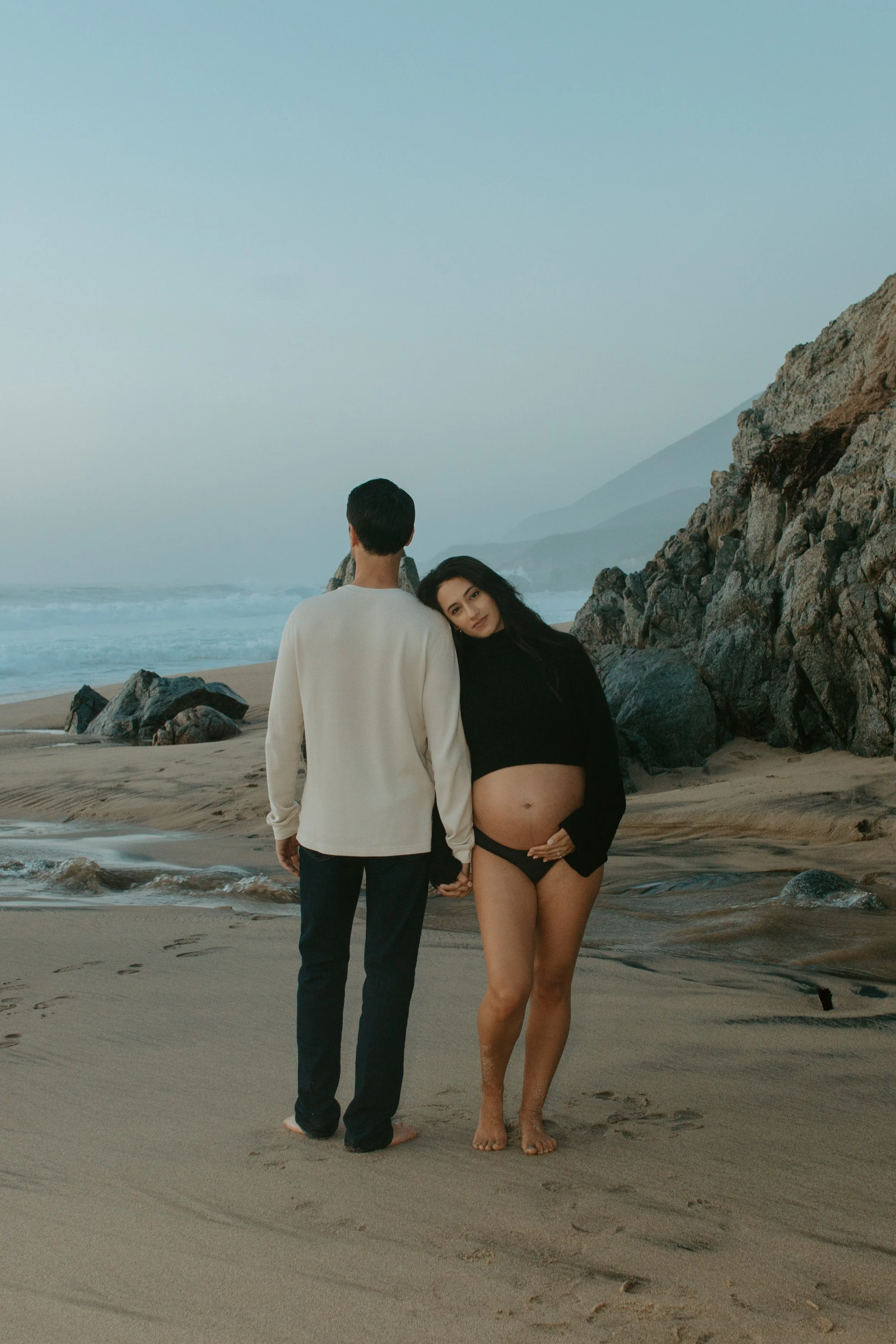 maternity photoshoot at garrapata beach in front of rocks