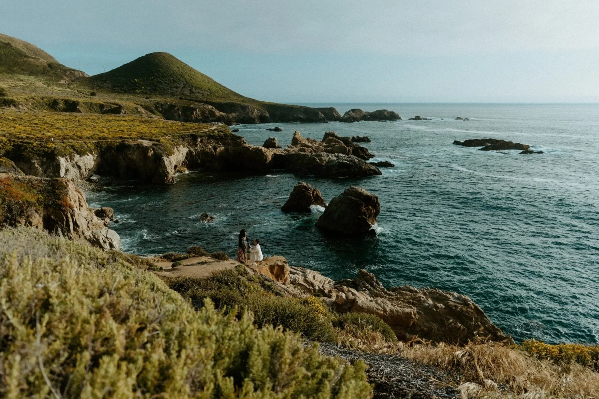 man proposing to woman at garrapata state park proposal painters point