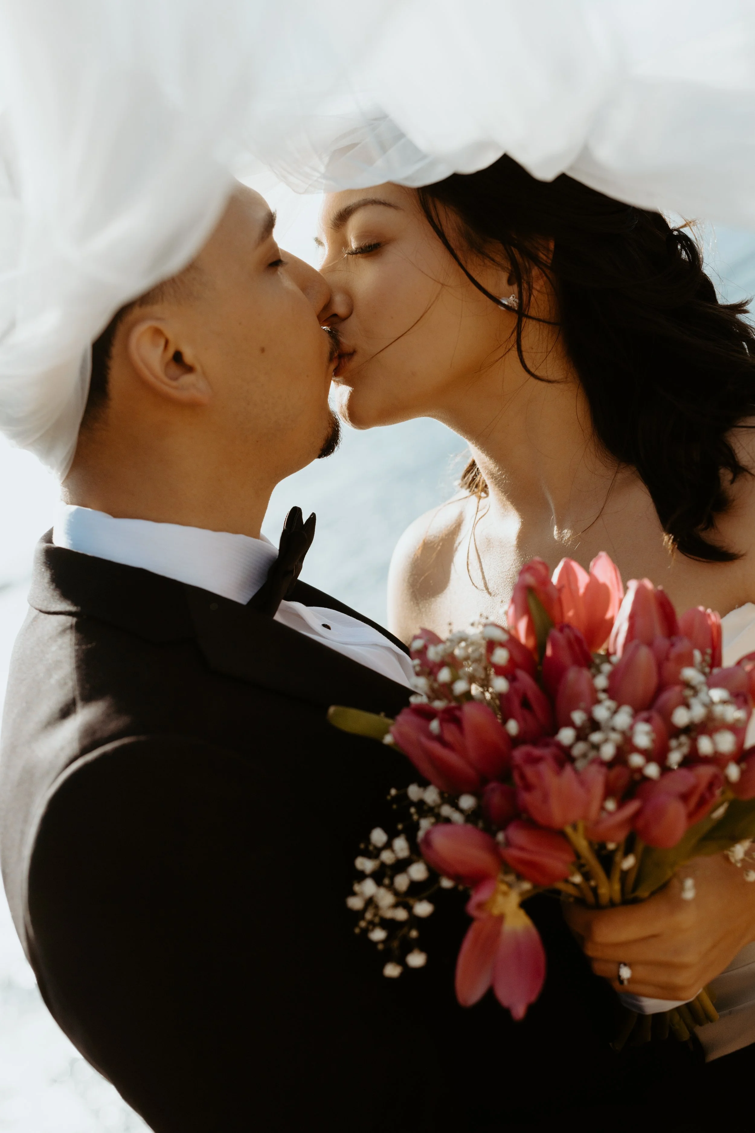a couple just married kissing after getting married in big sur