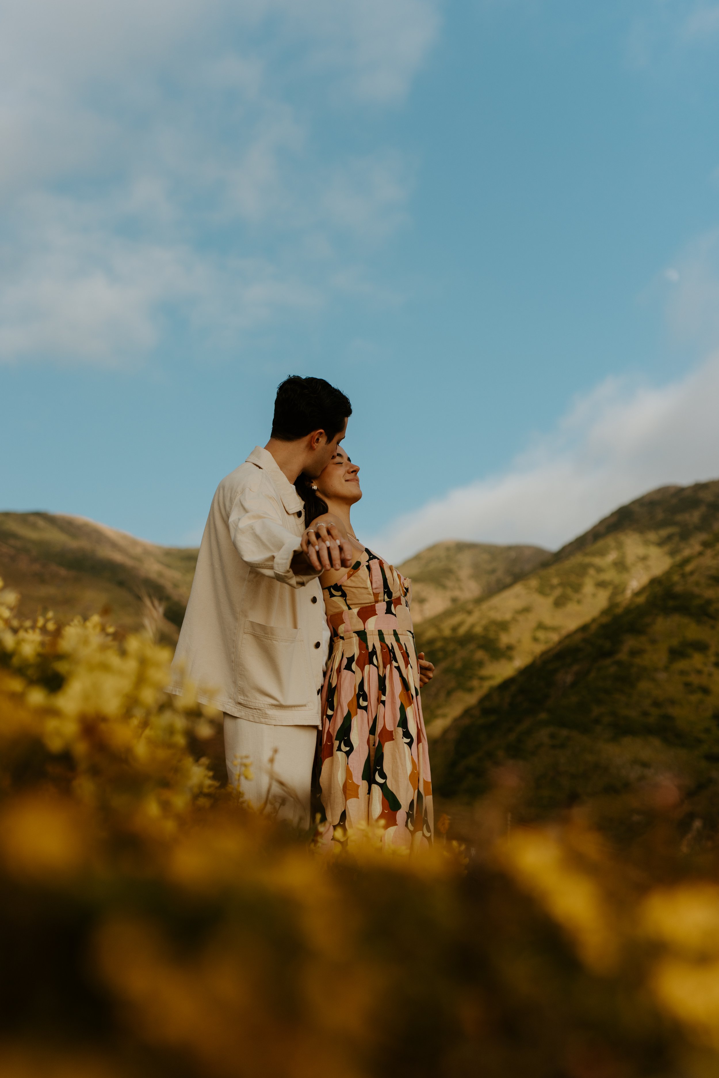 couple embracing at garrapata state park during couples session photoshoot