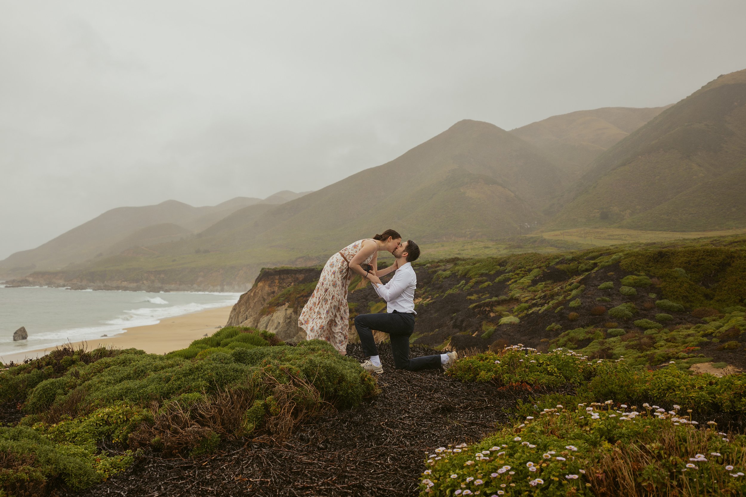 girl kissing guy after Carmel Proposal at garrapata state park