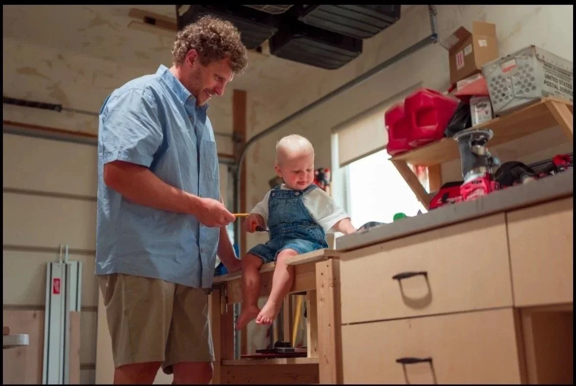 Utah Craftsman Owner, in his woodshop with his son, showing tool and wood species in Midway Utah.