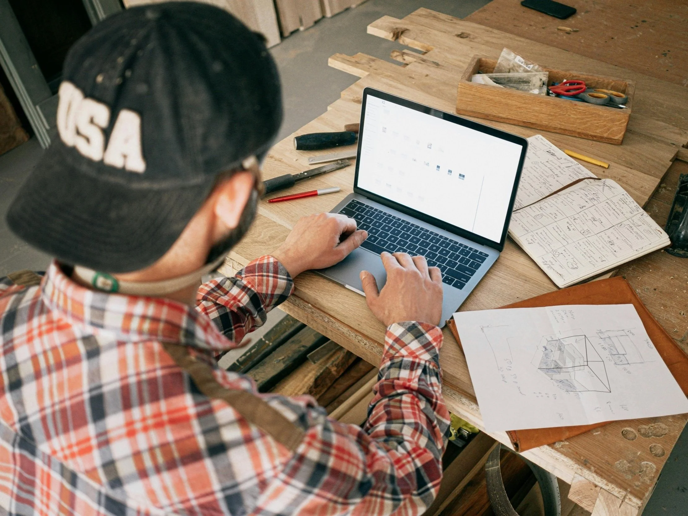 woodworker planing and desinging a project from scrap, computer 3D drawing, desinging in Midway Utah.