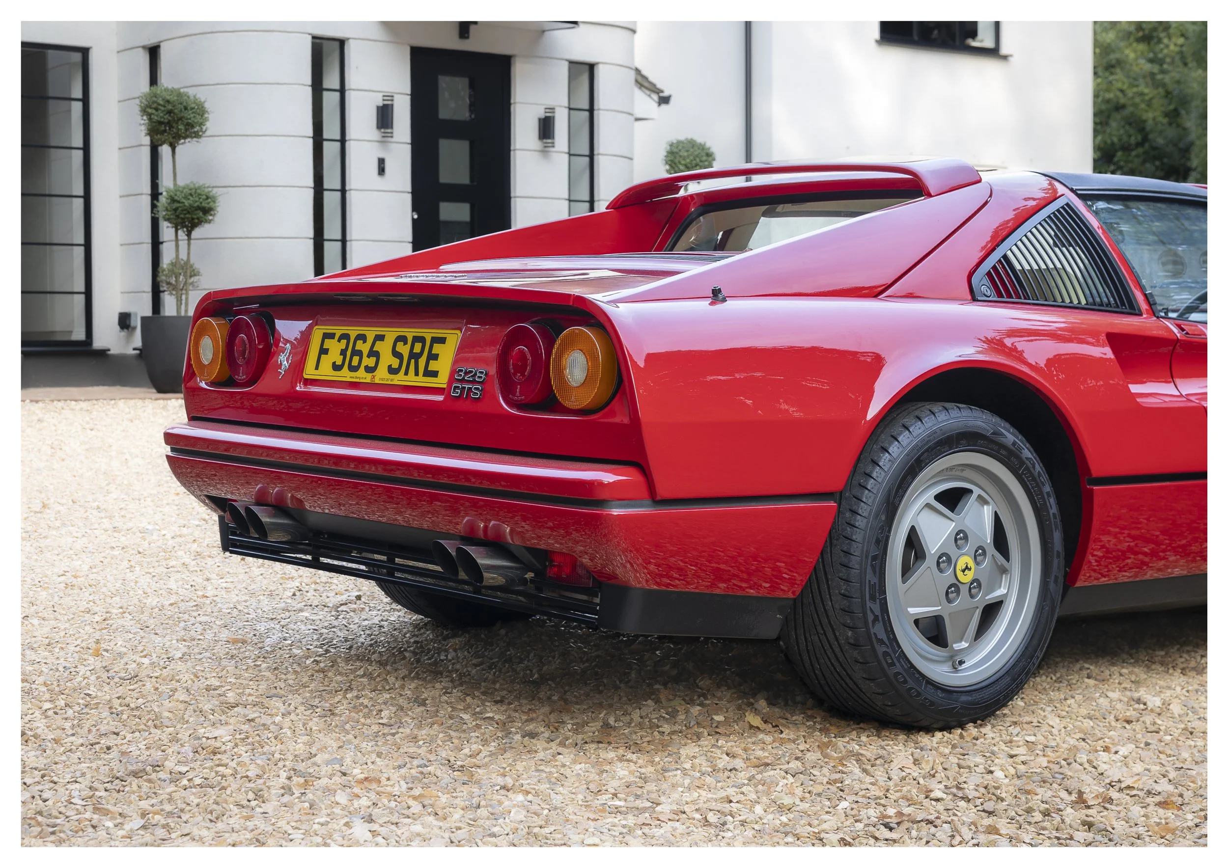 Red Ferrari 328 GTS from the 1980's rear three quarter view from right hand side