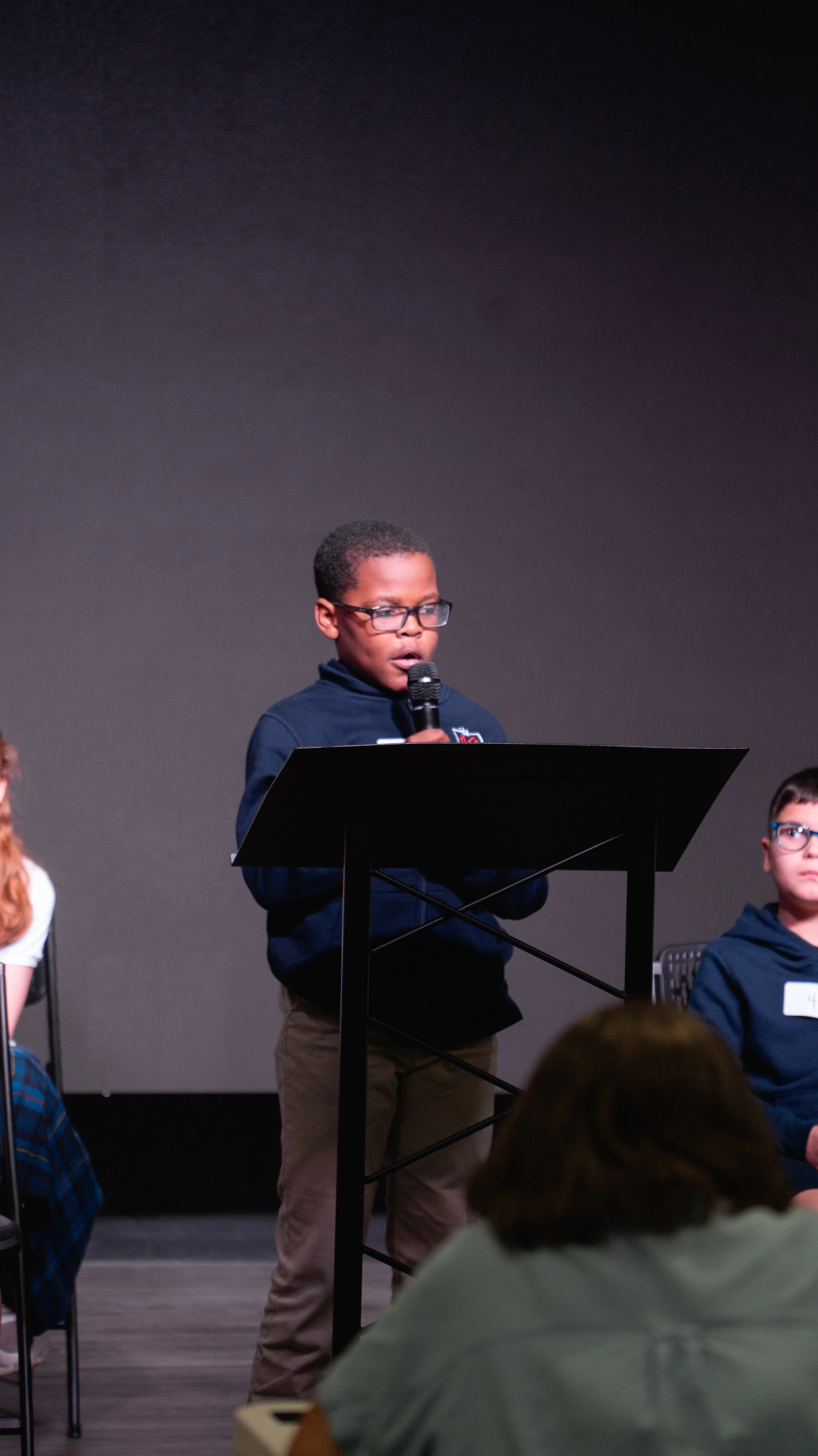 A middle school student taking part in public speaking at Kingdom Heights Preparatory School, a private Christian school in Huntsville, Alabama.
