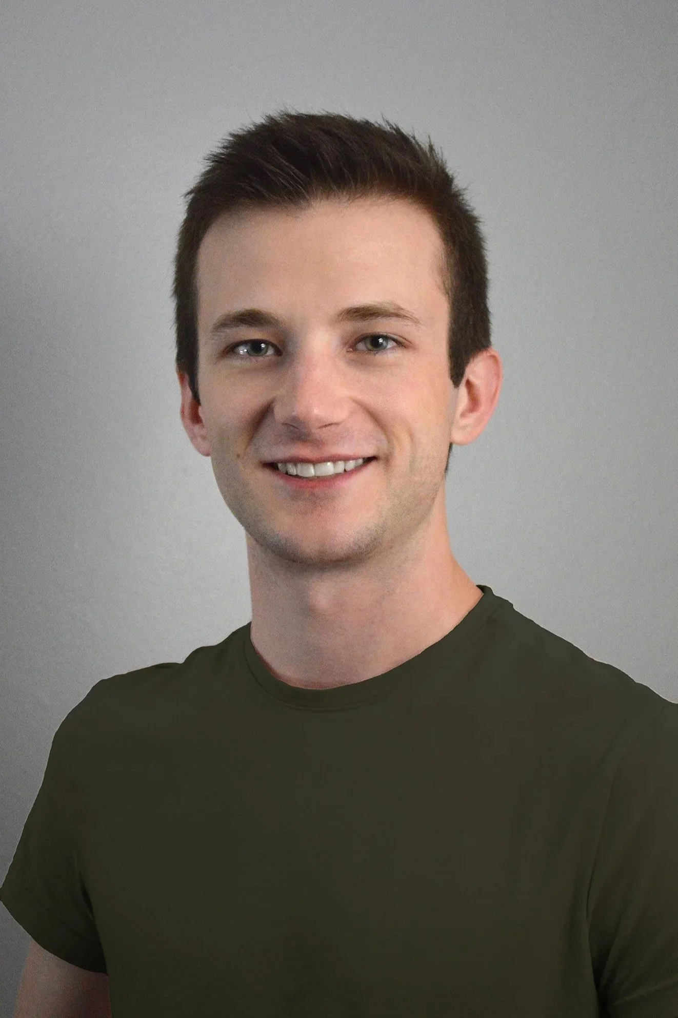 Headshot of Cutler smiling at camera
