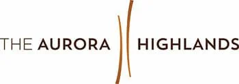 Graphic logo with the text "THE AURORA HIGHLANDS" separated by a vertical orange line.