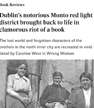 Black and white photo of three women standing outdoors, in front of a house, with a barren tree in the background.