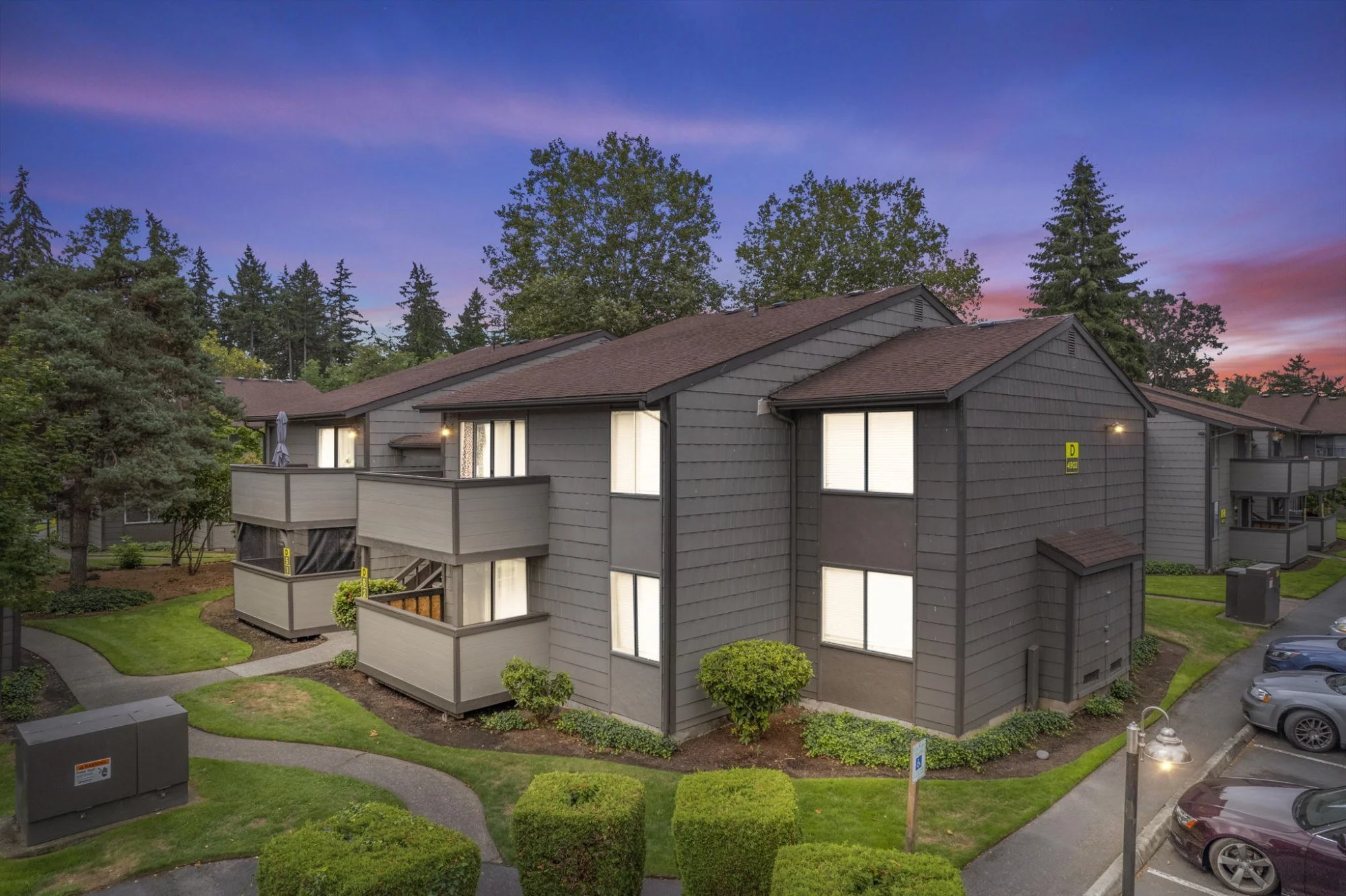 Lakewood multi-unit residential property during sunset with landscaped grounds managed by Starboard Real Estate