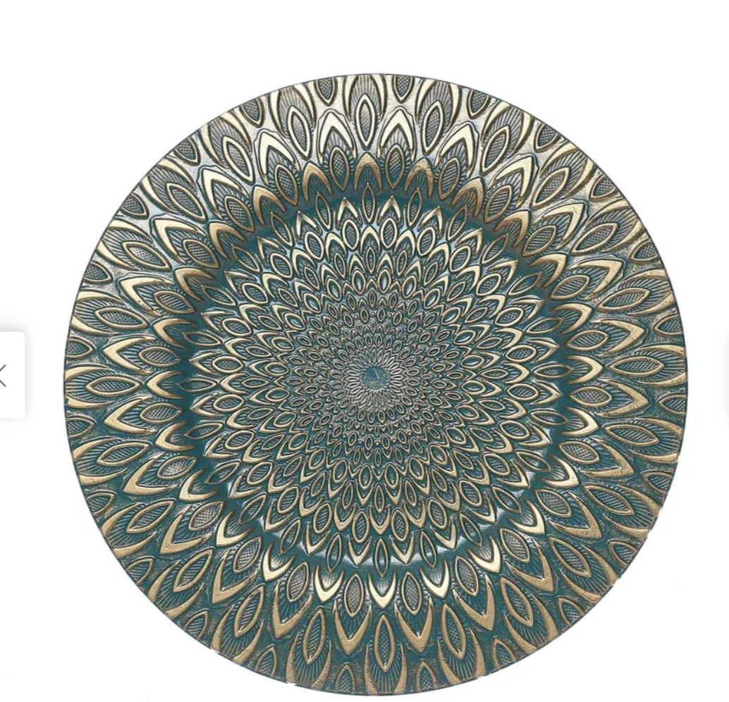 A decorative round plate with an intricate, colorful geometric pattern resembling a hypnotic mandala in shades of blue, gold, and cream.