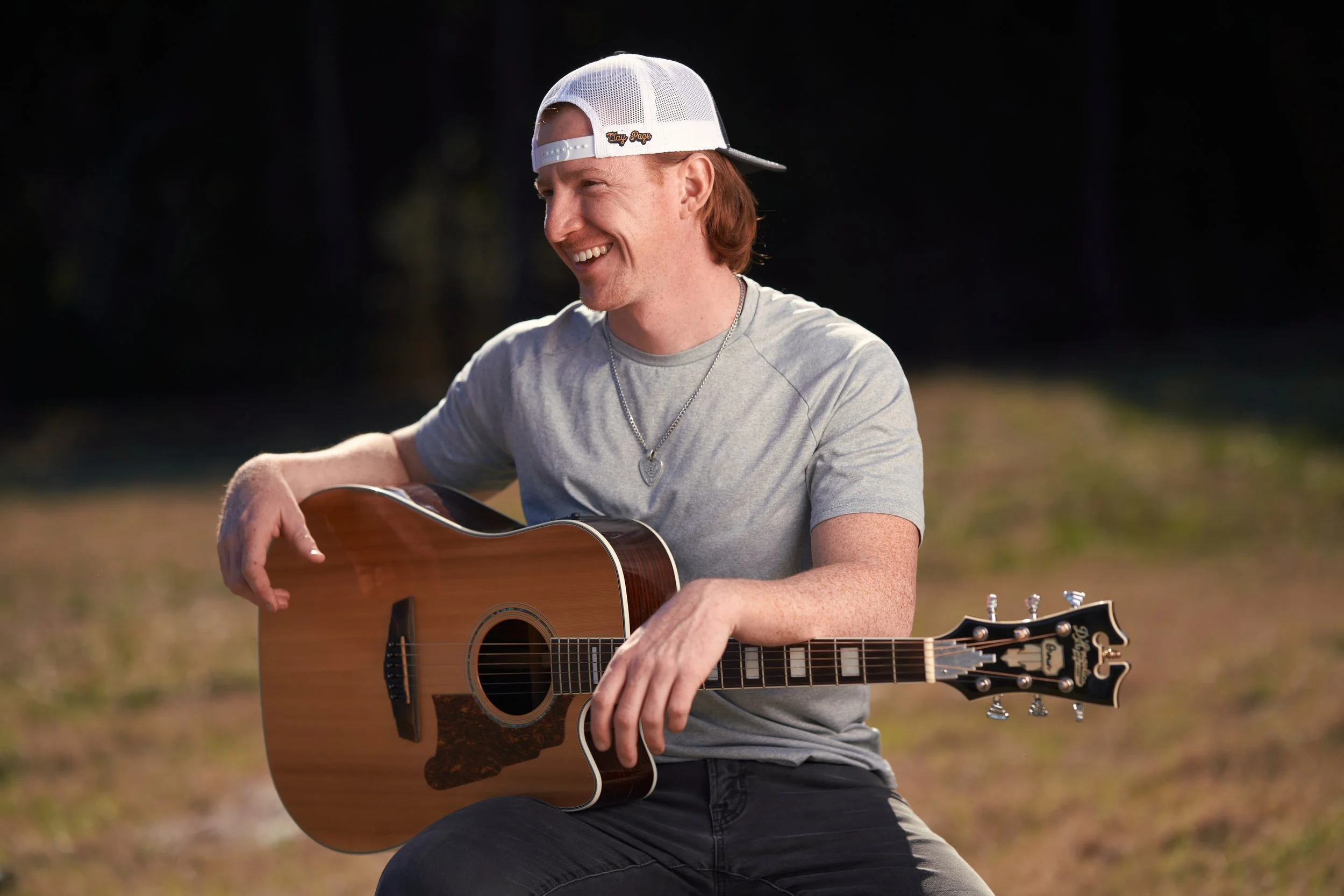 smiling music artist with guitar.jpg