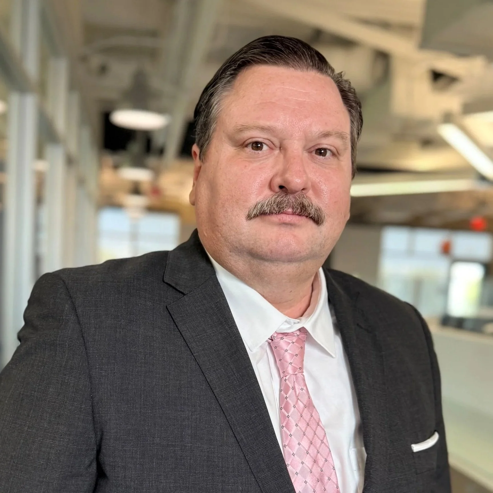 An attorney in a suit and tie.