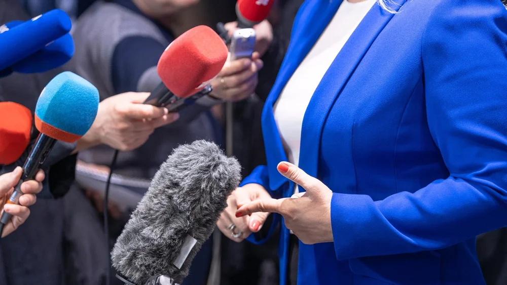 Spokesperson answering questions from reporters