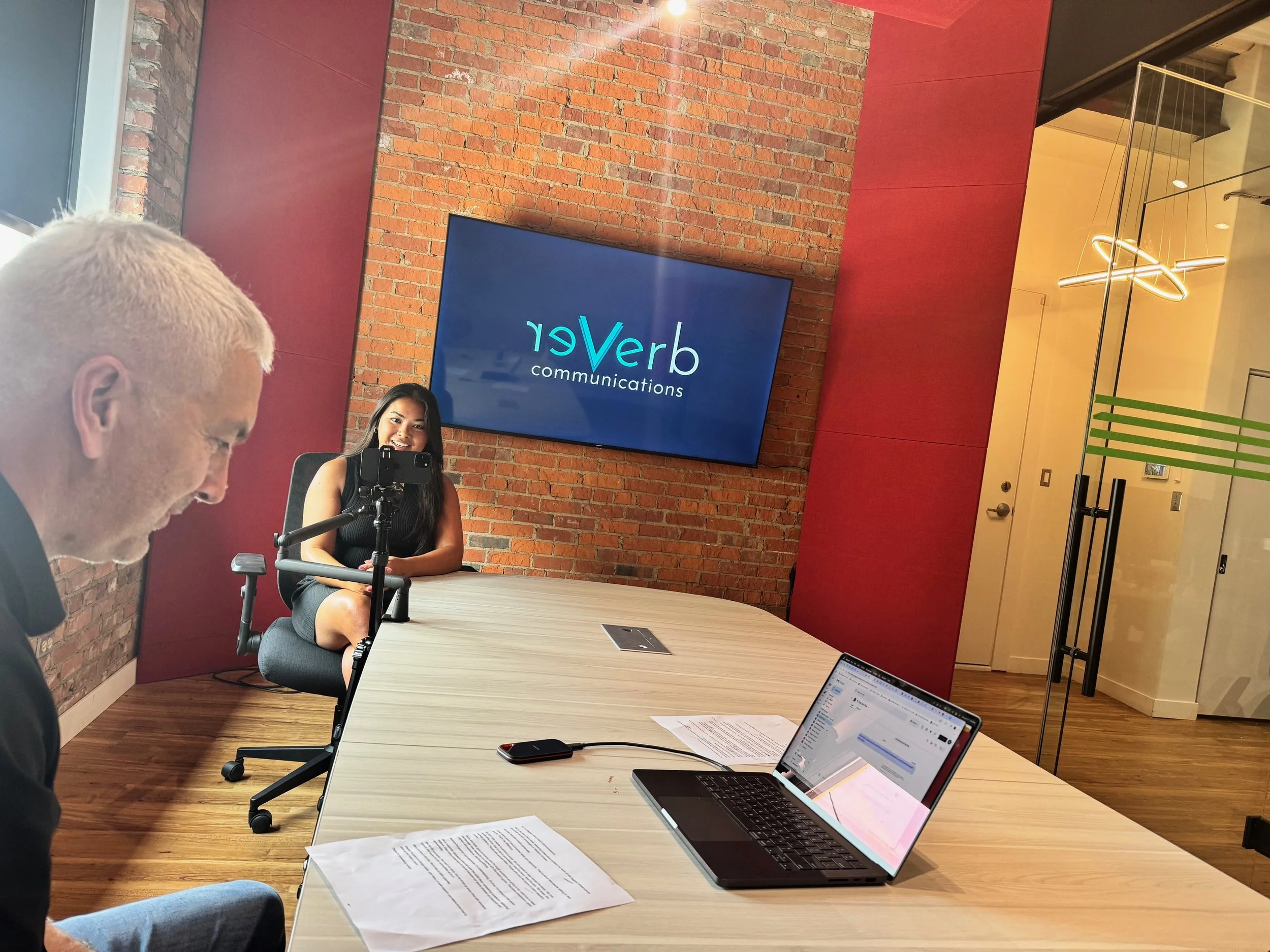 Meghan and Glenn filming a video in reVerb's office