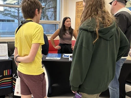 reVerb team member speaking with residents at a public open house