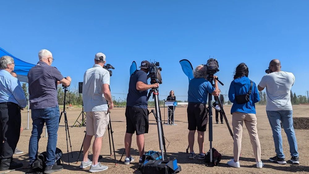 Media cameras at a groundbreaking ceremony