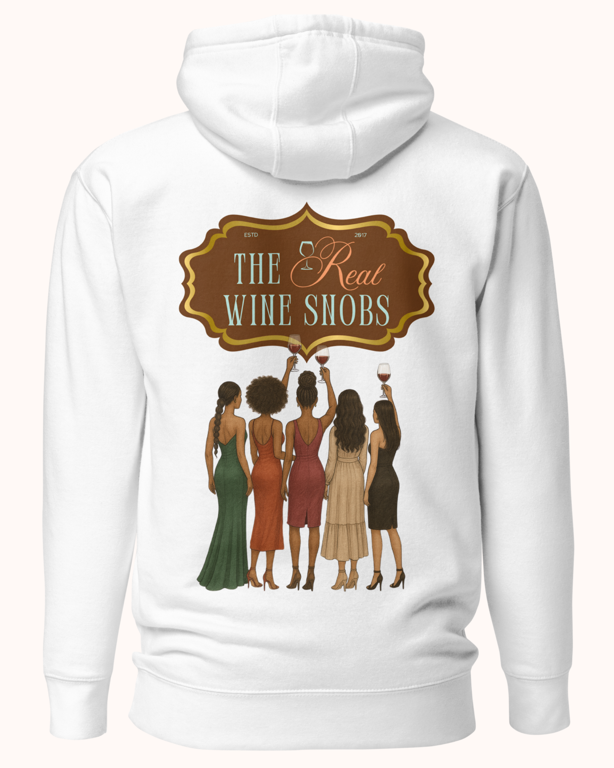 The Real Wine Snobs Snob Hoodie features women raising wine glasses beneath the brand crest. A fleece-lined hoodie designed for tastings, girls’ nights, and wine lovers with a little attitude.