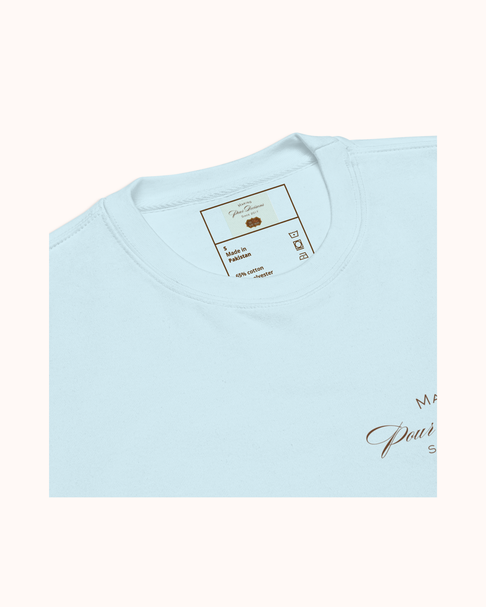 Premium wine sweatshirt with “Making Pour Decisions Since 2017” on the front and The Real Wine Snobs logo on the back. Structured unisex fit with cotton face and fleece interior. Sizes S–3XL.