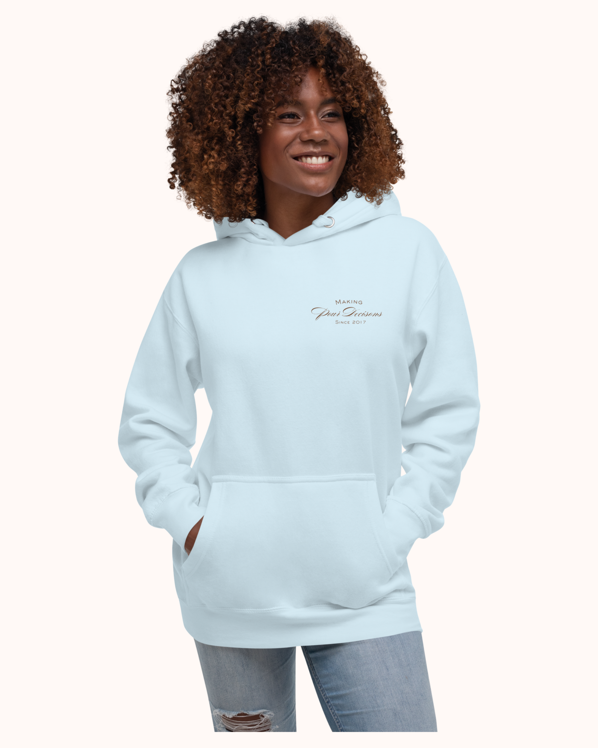 The Real Wine Snobs Snob Hoodie features women raising wine glasses beneath the brand crest. A fleece-lined hoodie designed for tastings, girls’ nights, and wine lovers with a little attitude.