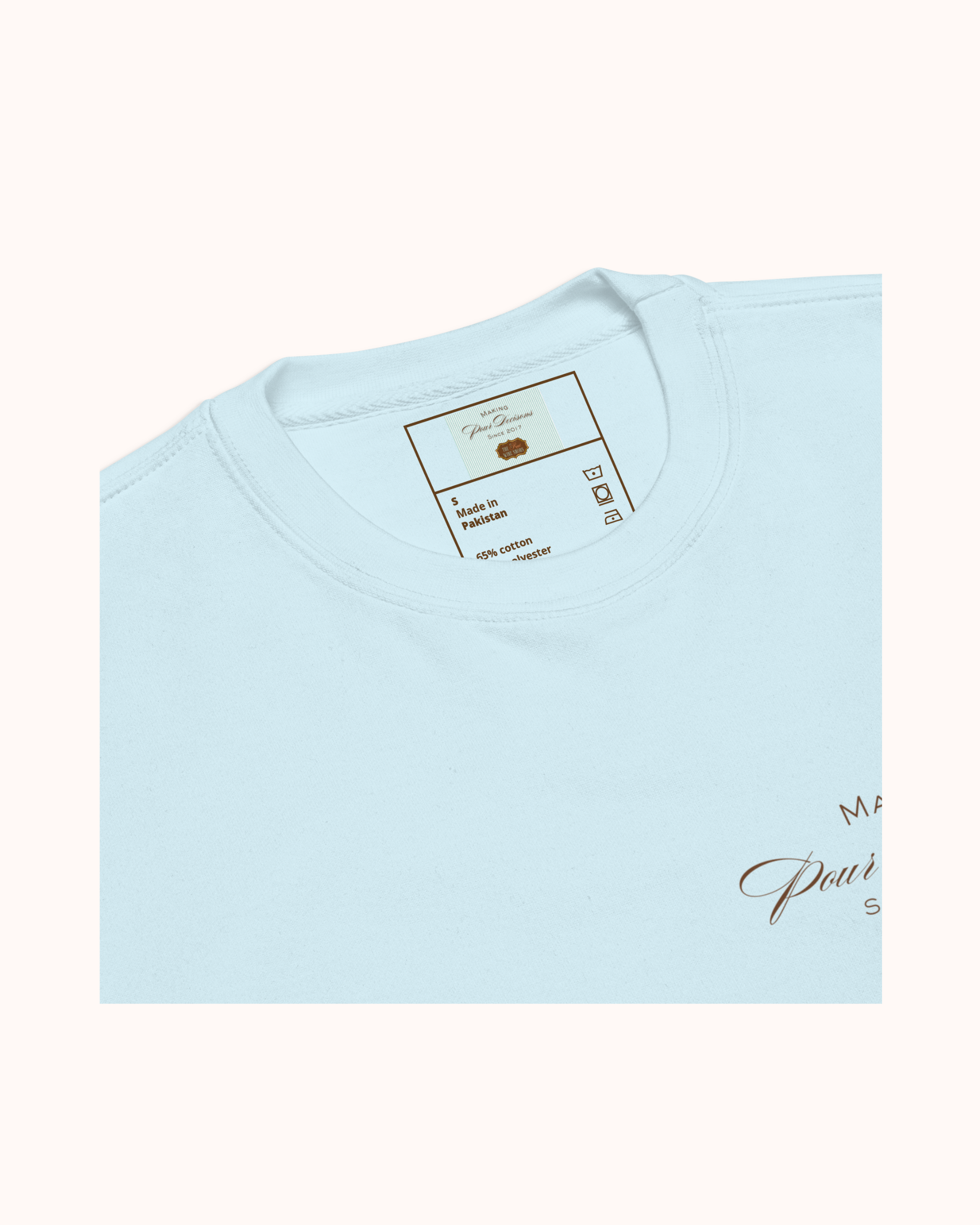 Premium wine sweatshirt with “Making Pour Decisions Since 2017” on the front and logo on back. Structured unisex fit, cotton face, fleece interior. Sizes S–3XL.