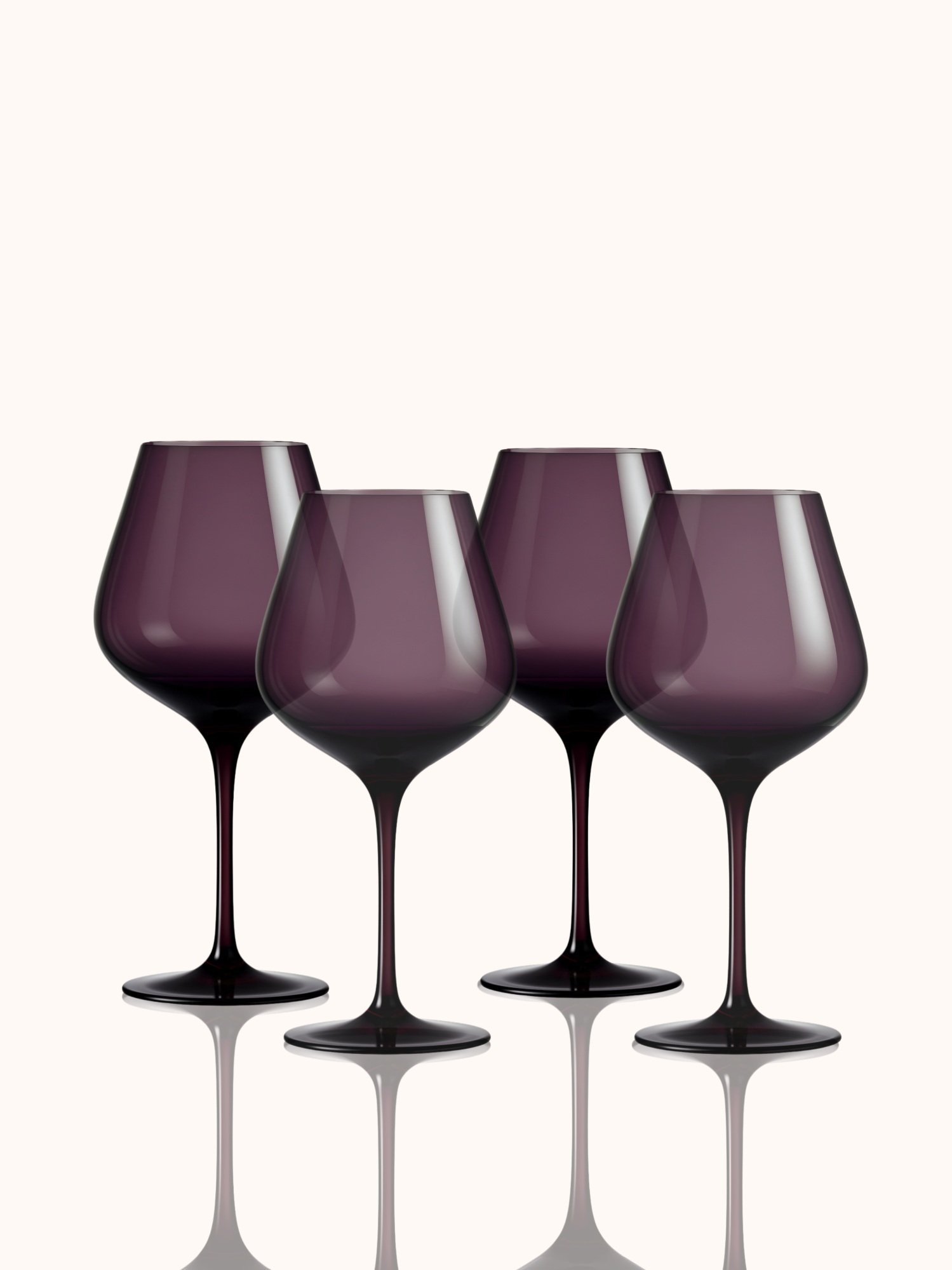This set of 4 plum-hued wine glasses is rich, romantic, and just a bit dramatic. Hand-blown crystal made for sipping in the spotlight—even if you are the whole show.