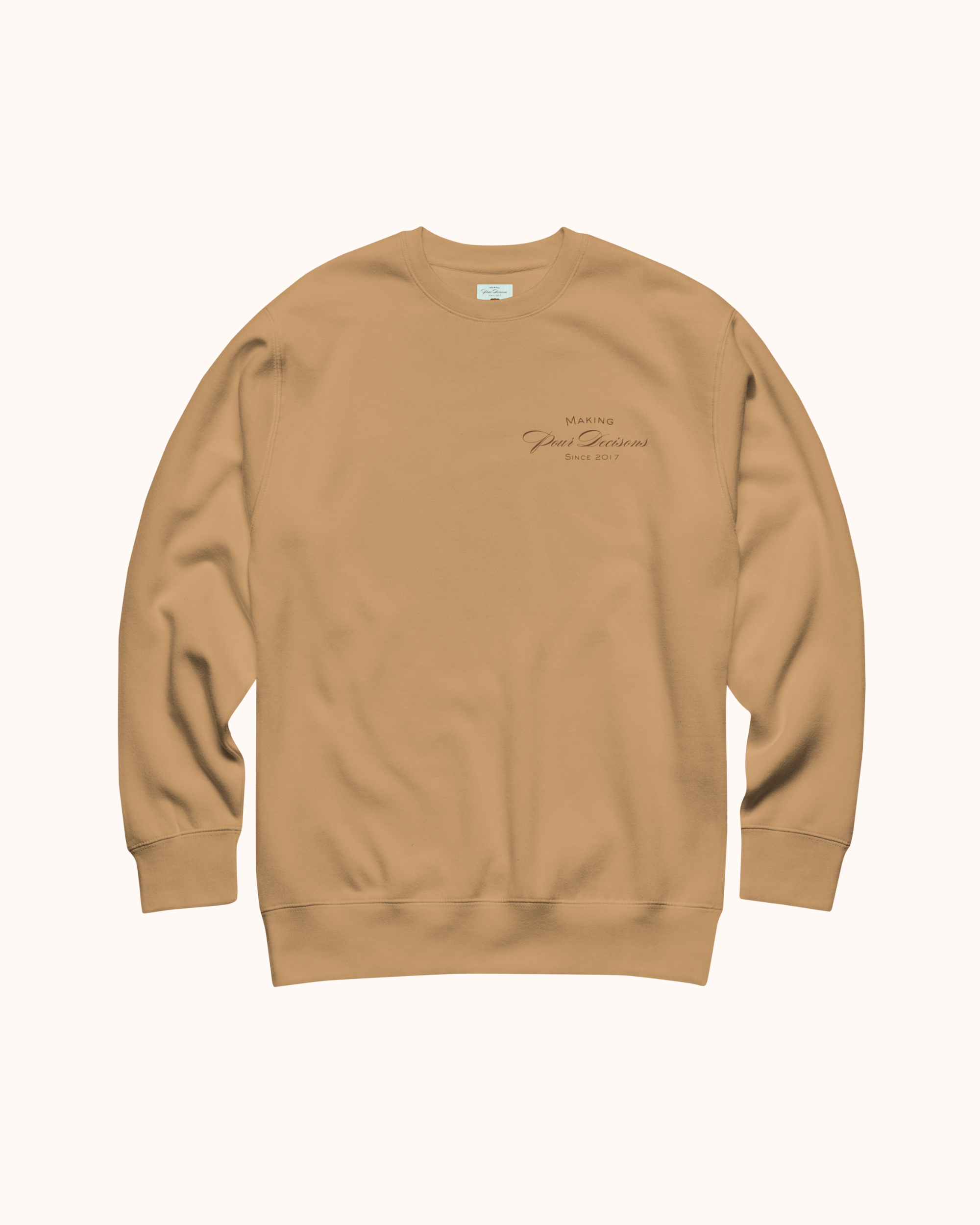 Premium wine sweatshirt with “Making Pour Decisions Since 2017” on the front and logo on back. Structured unisex fit, cotton face, fleece interior. Sizes S–3XL.