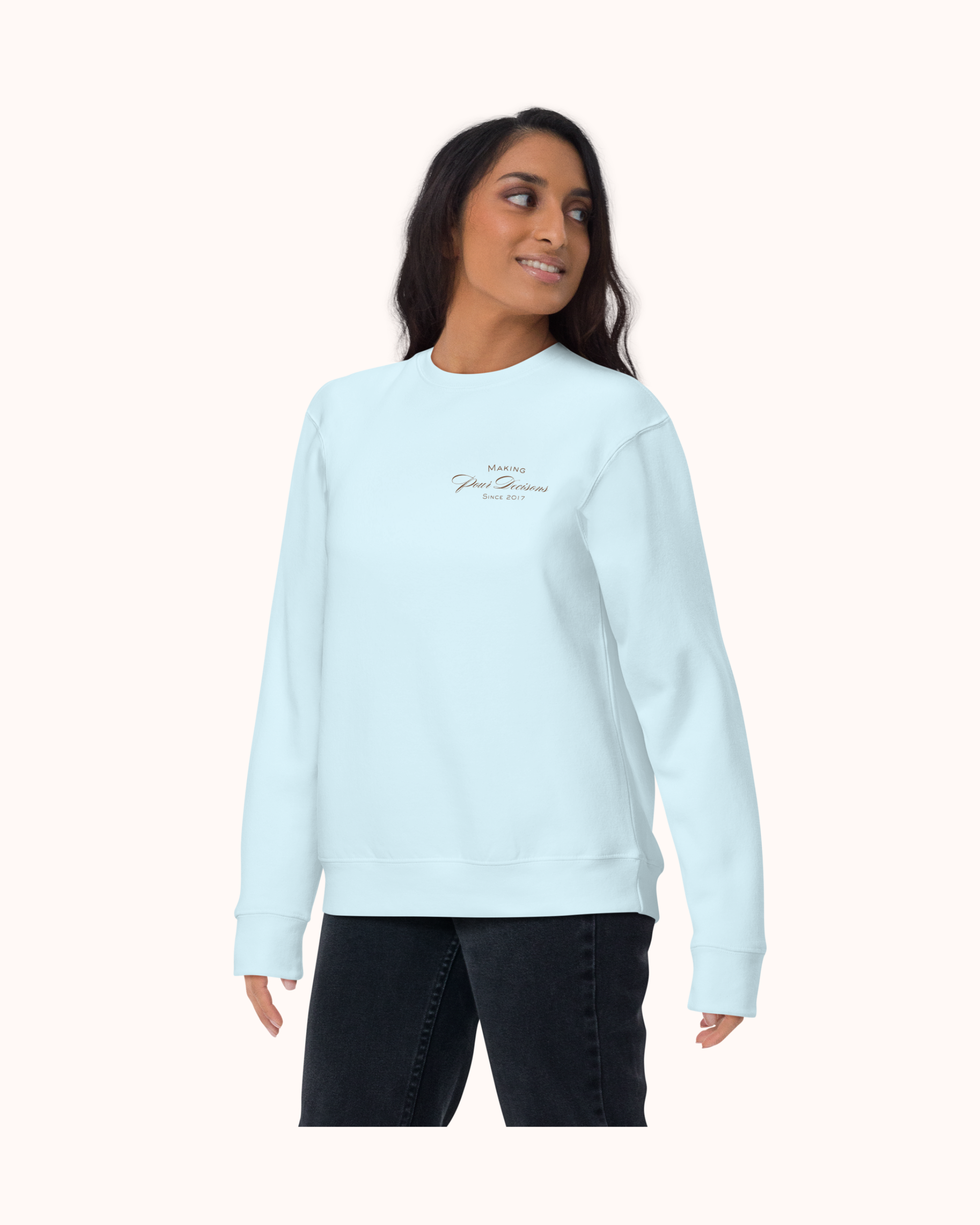 Premium wine sweatshirt with “Making Pour Decisions Since 2017” on the front and logo on back. Structured unisex fit, cotton face, fleece interior. Sizes S–3XL.