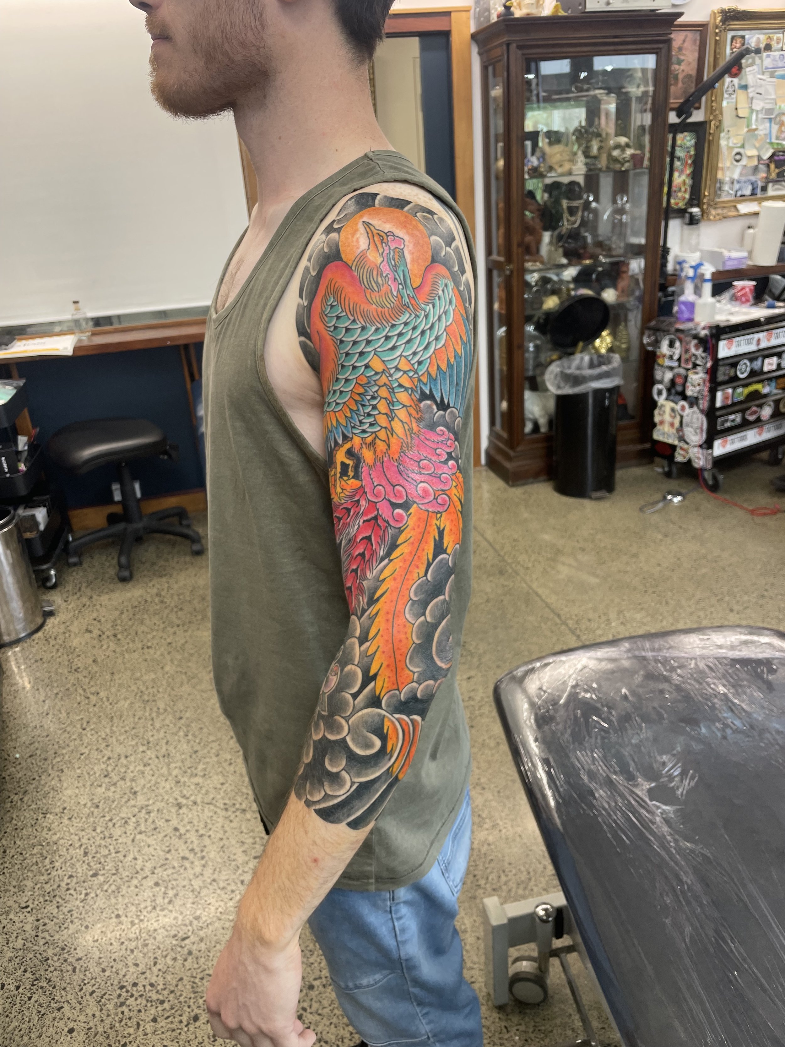 Full view of a Japanese phoenix sleeve tattoo wrapping around the arm – large-scale custom tattoo by Auckland-based artist.