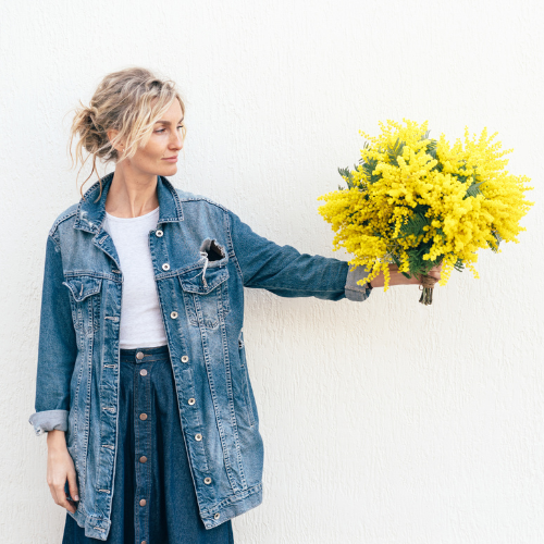 Women holding flowers looking to the future image