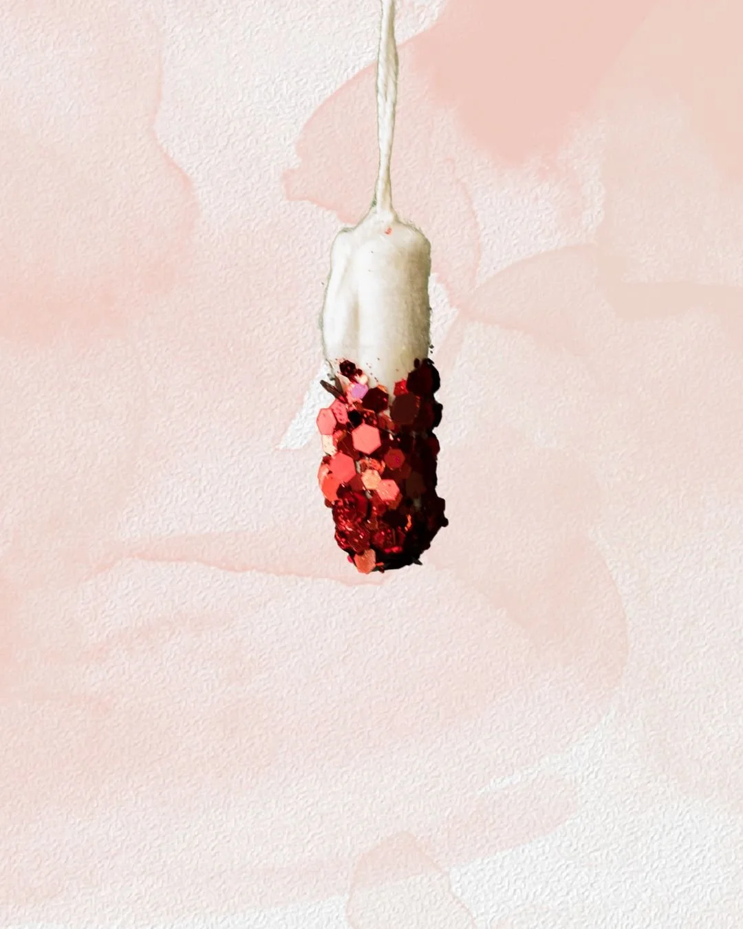 image of tampon with red sequins