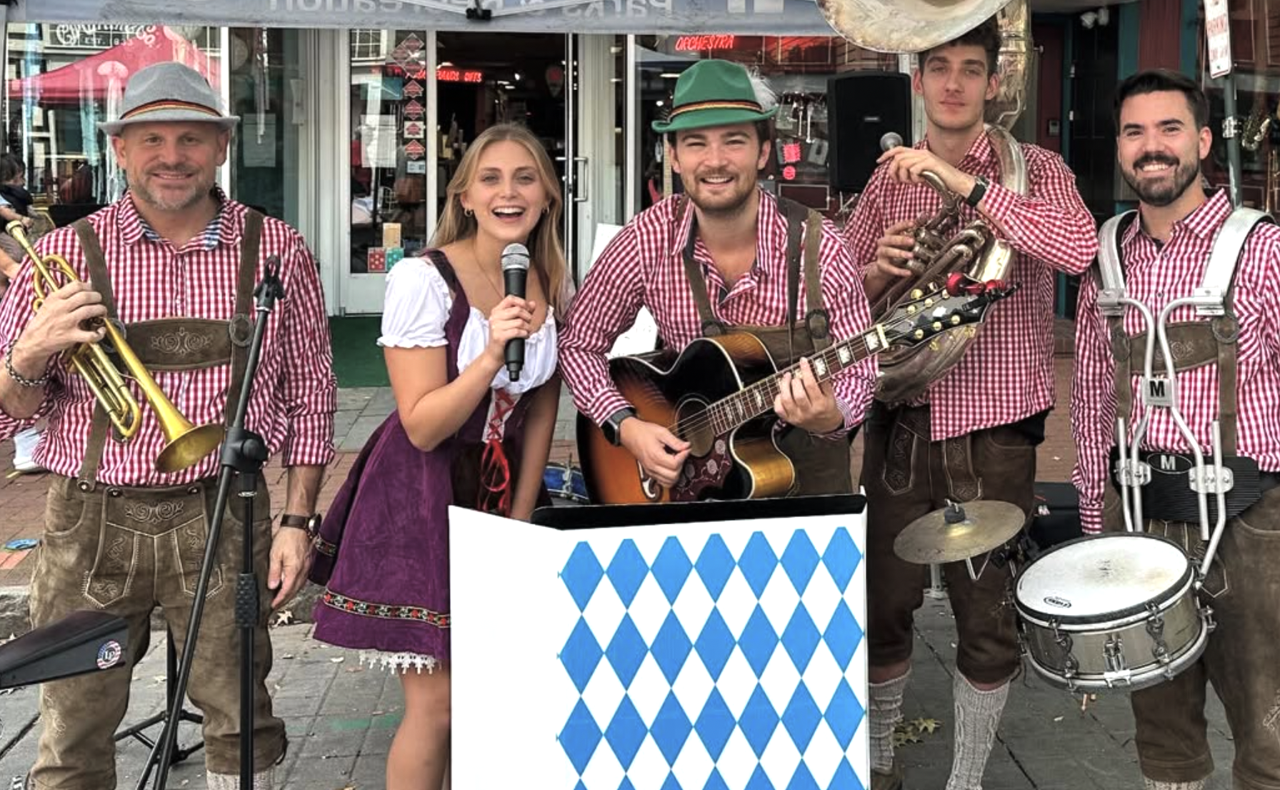 Giacomo and Sierra in lederhosen doing an Oktoberfest show