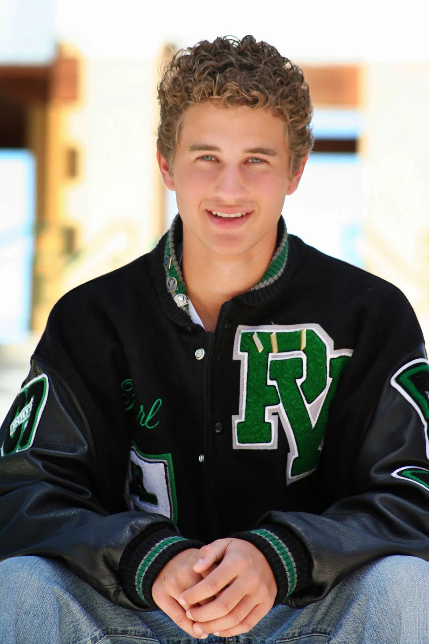 A close up shot of a high school senior wearing his letterman jacket for Palo Verde High School in Las Vegas