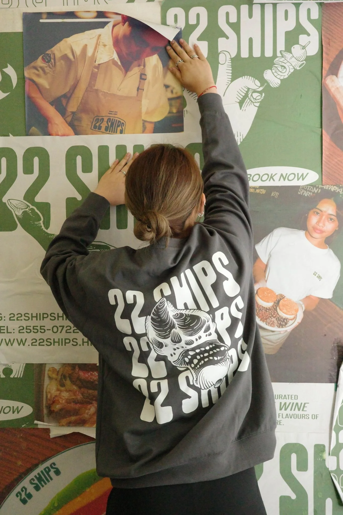 22 Ships Sweater Dark Grey with wall touching.jpg