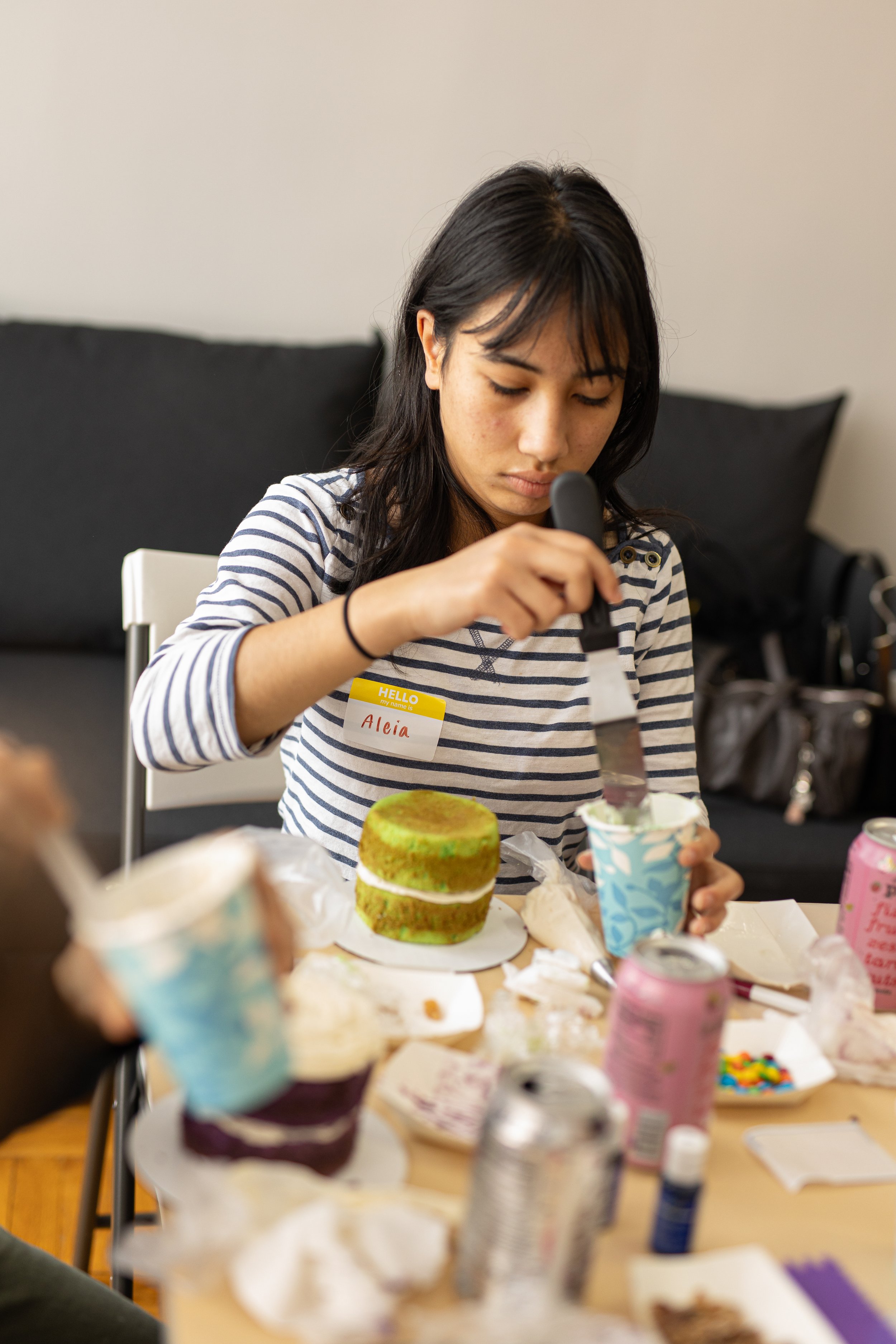 Lady decorating a cake