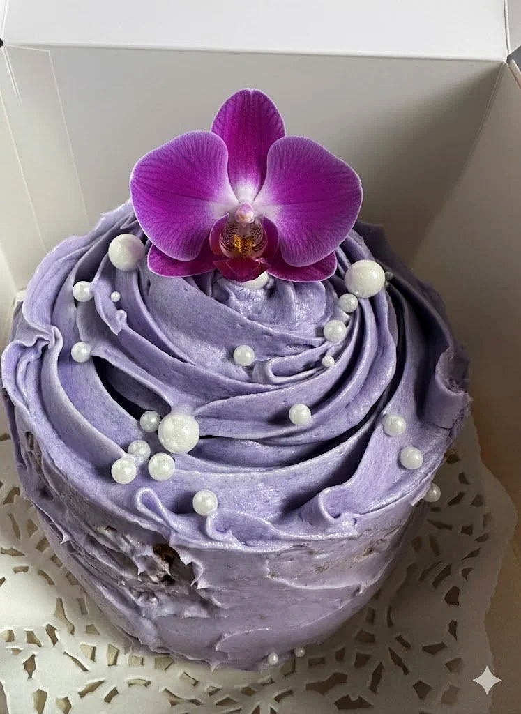 ube cake with white pearls and purple orchid