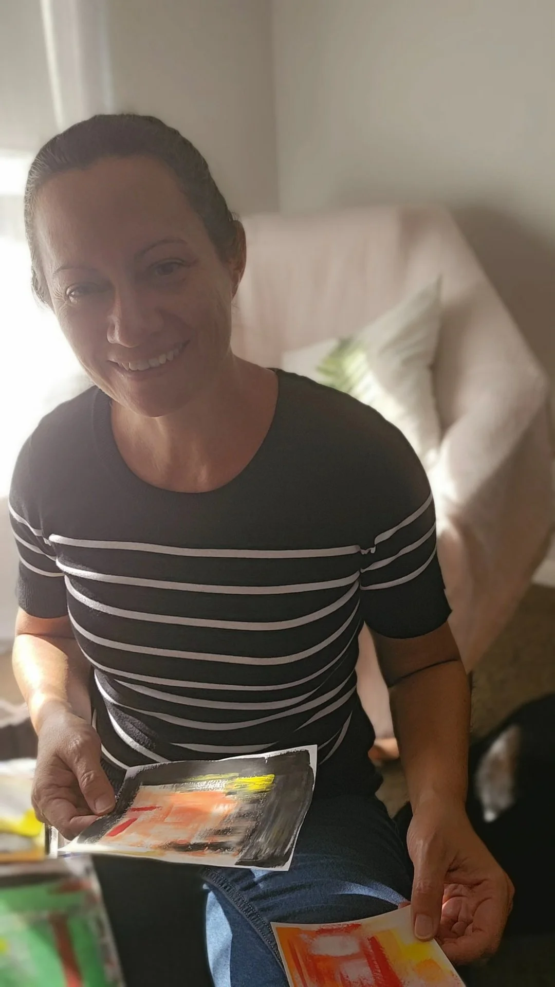 Debra holding journal pages