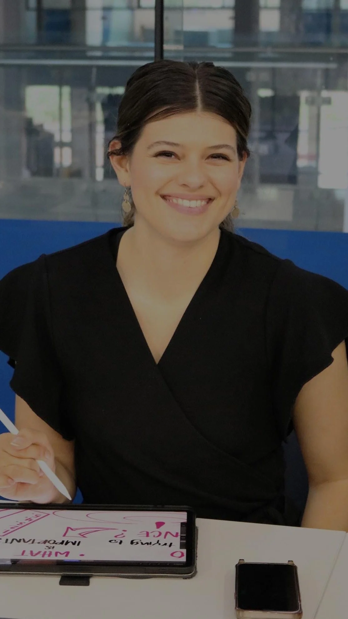 Smiling person with digital tablet and stylus