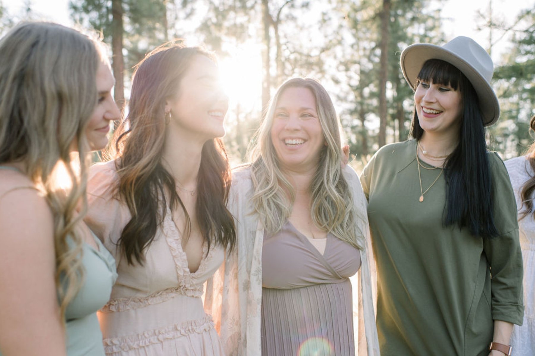 A photo of Brandy Madison events team posing together laughing and smiling at each other