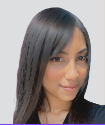 Close-up of a woman with straight dark hair, smiling gently, against a light background.