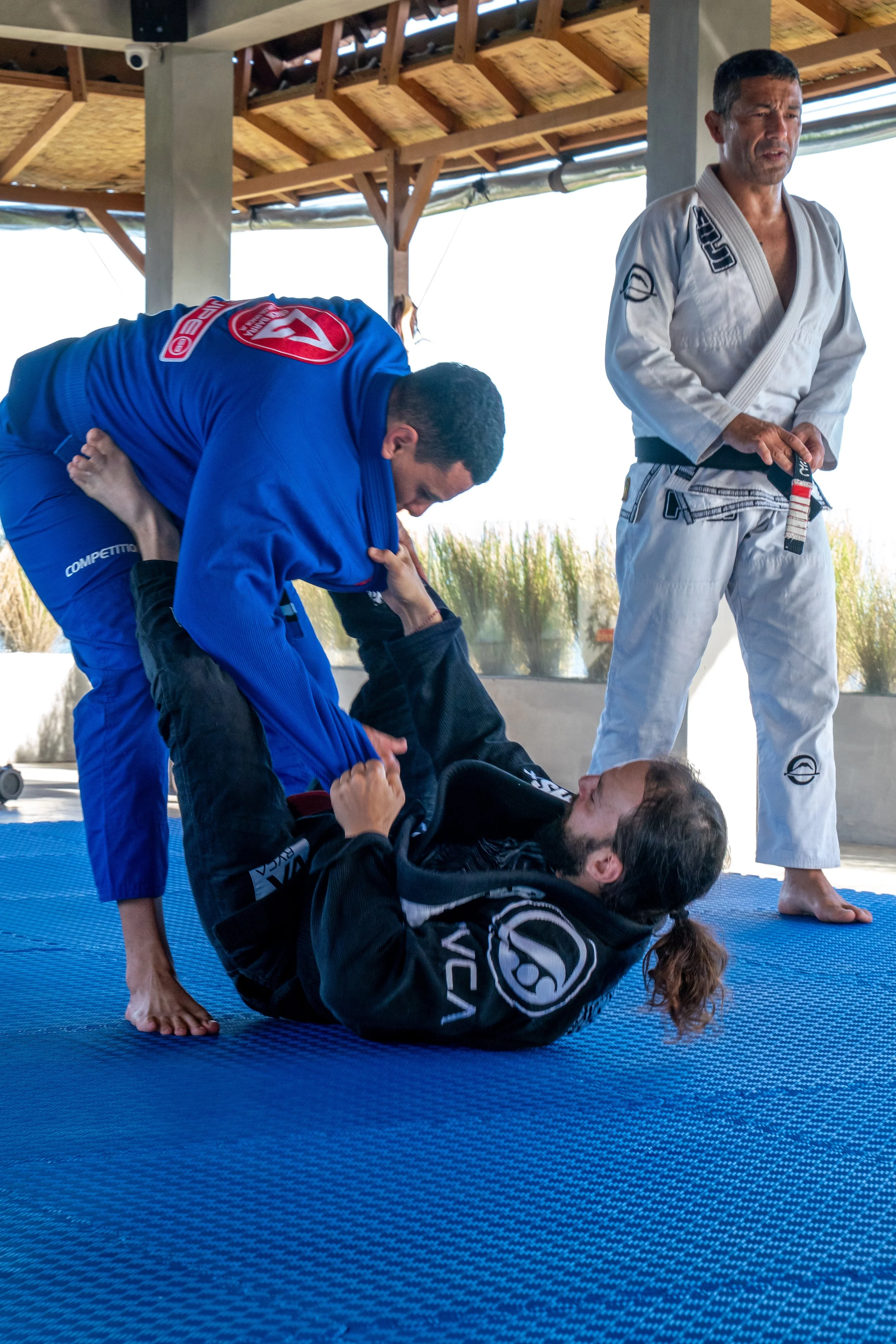 Brazilian Jiujitsu on a rooftop in Uluwatu, Bali with ocean views