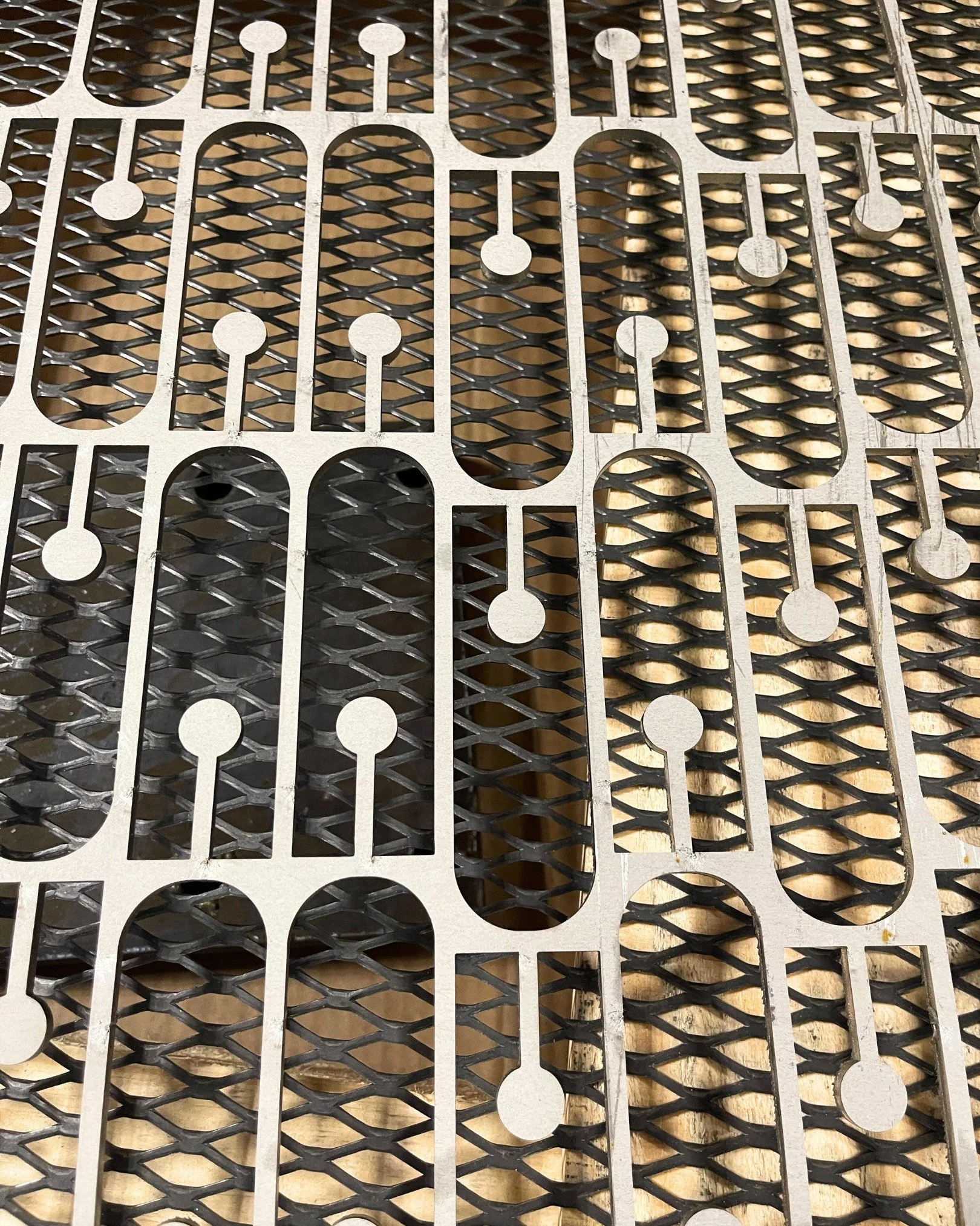 We like to think of it as our shop's unofficial artwork. You're actually looking at what remains *after* the cuts. Any guesses on the process we used here?