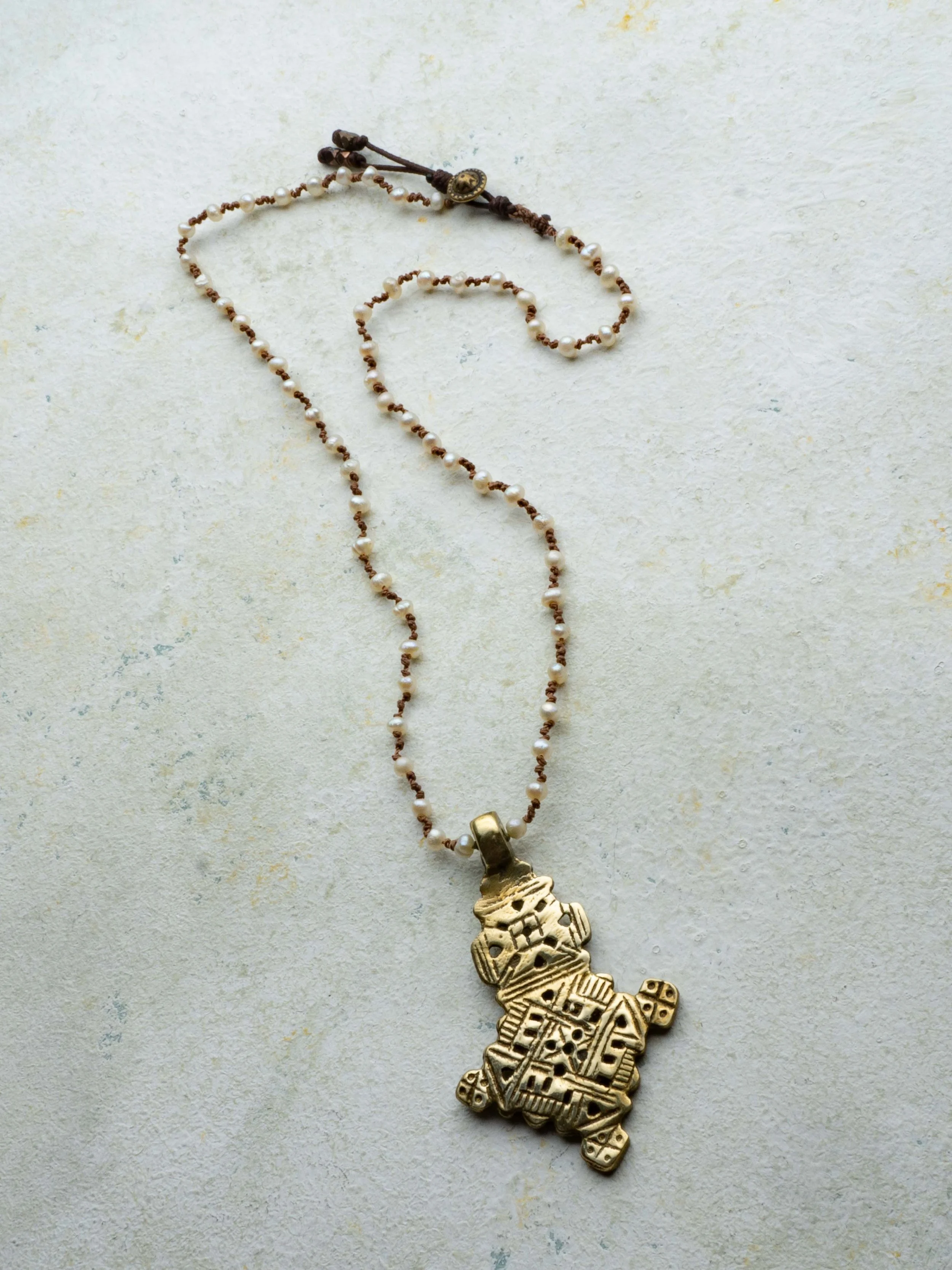 Tiny Pearl with Ethiopian Cross