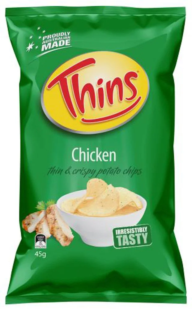Green snack bag of Thins chicken flavored potato chips, weighing 45 grams, featuring an image of potato chips in a white bowl and chicken strips on the front.