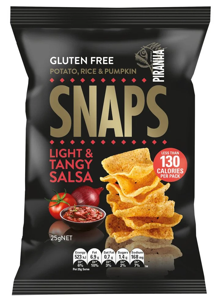 A bag of Piranha Snaps light and tangy salsa flavored snack chips. The bag is black with gold and red accents, showing an image of stacked chips, a bowl of salsa, a tomato, and an onion. The package indicates it is gluten free, low in calories (less than 130 per pack), and contains 25 grams net weight.