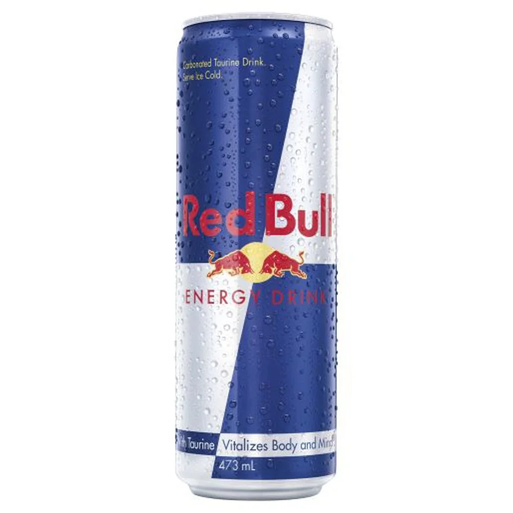 A can of Red Bull energy drink, blue and silver with a yellow and red logo, surrounded by water droplets.